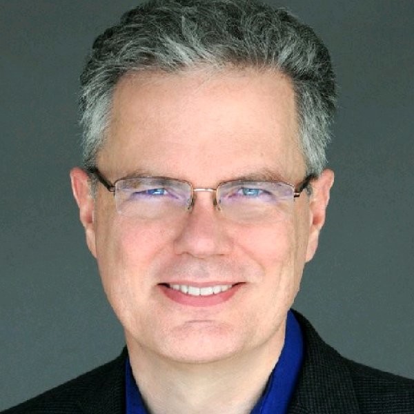 A headshot of Thomas Cox