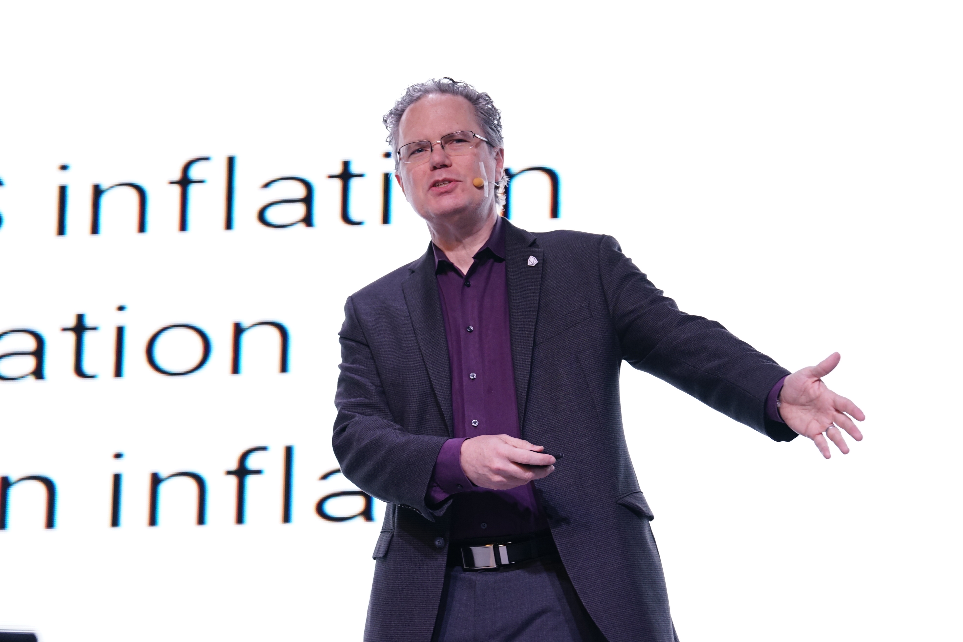 Thomas Cox speaks from a stage in Seoul, South Korea.